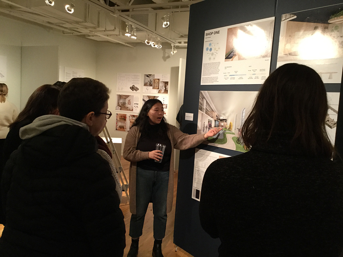 A group of ladies looking at design possibilities for Shop One.