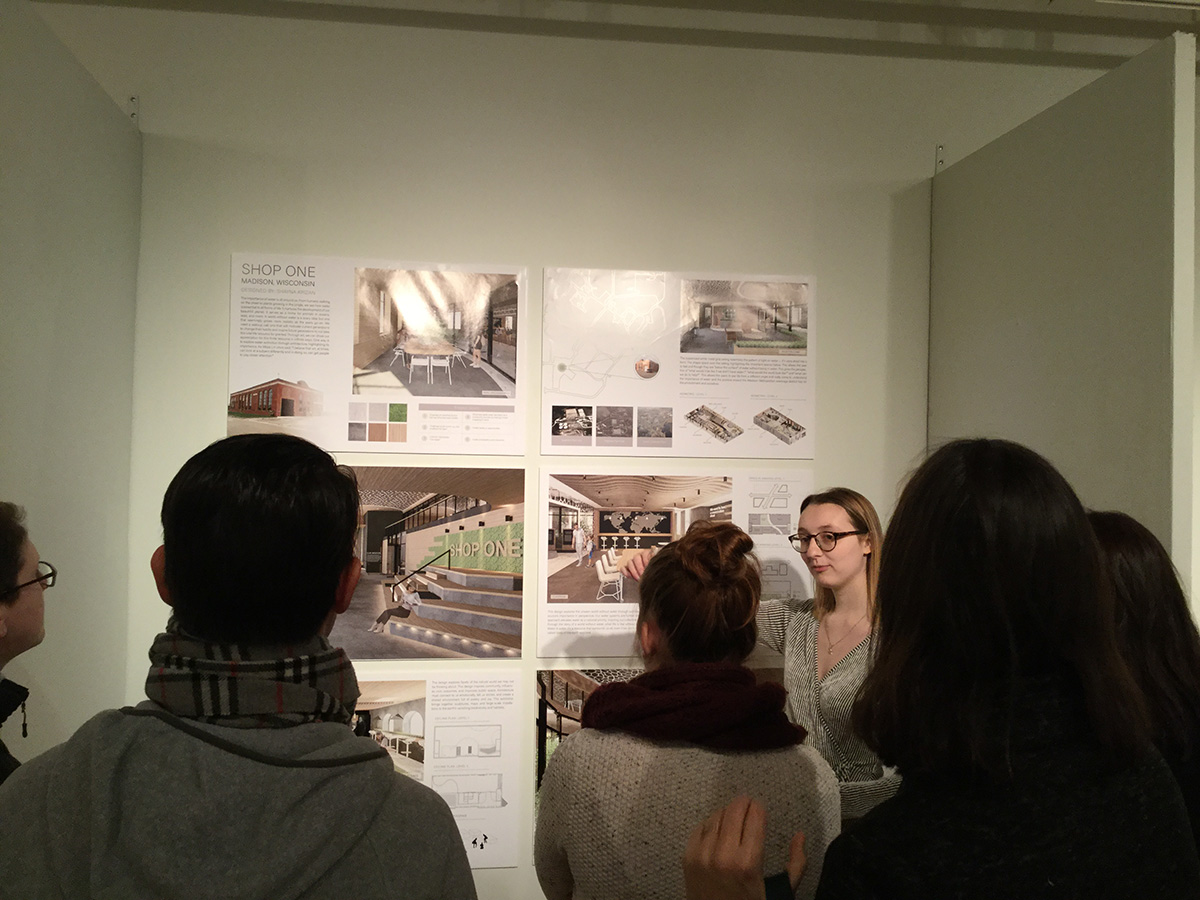 A group of people looking at design possibilities for Shop One.