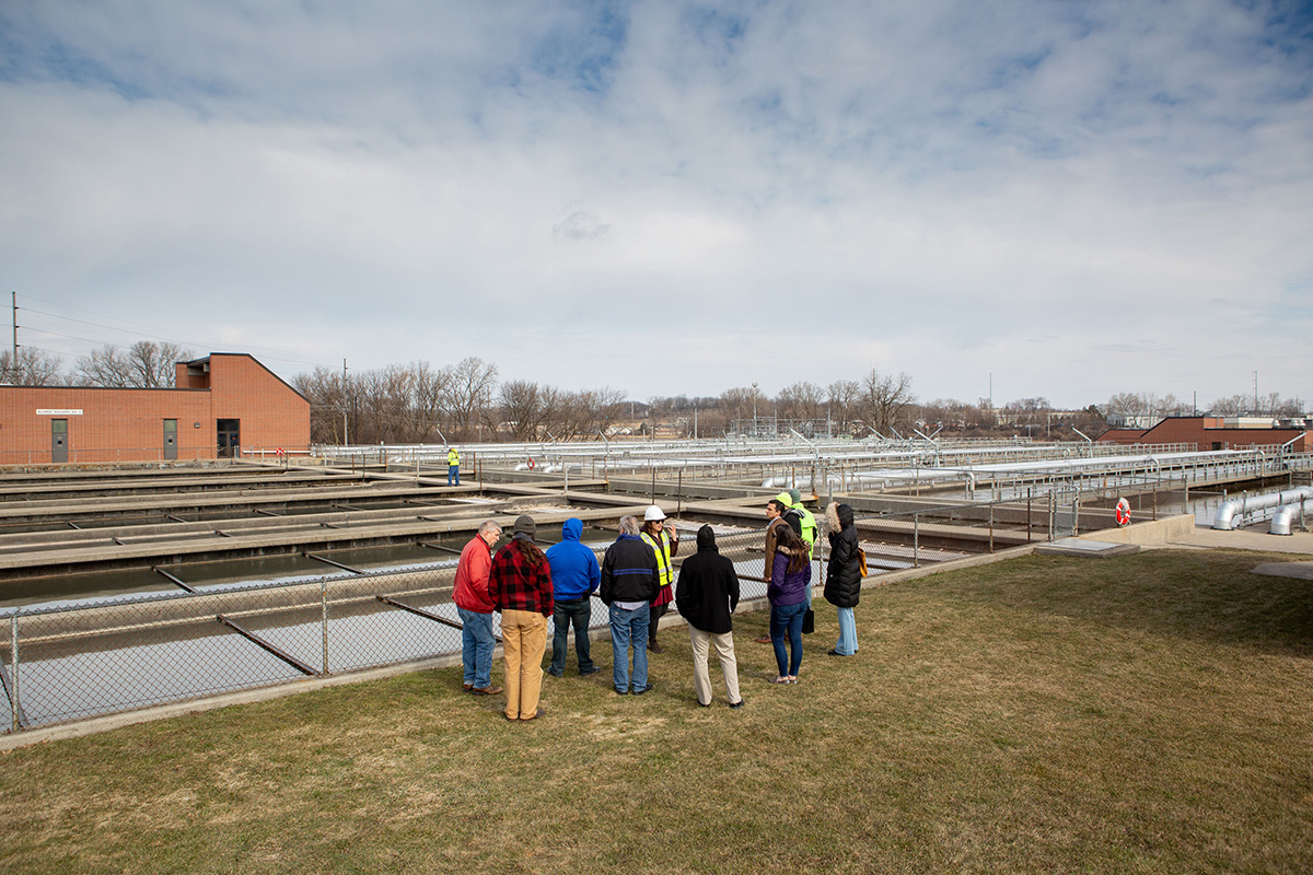A District staff member leading a tour group around the plant.